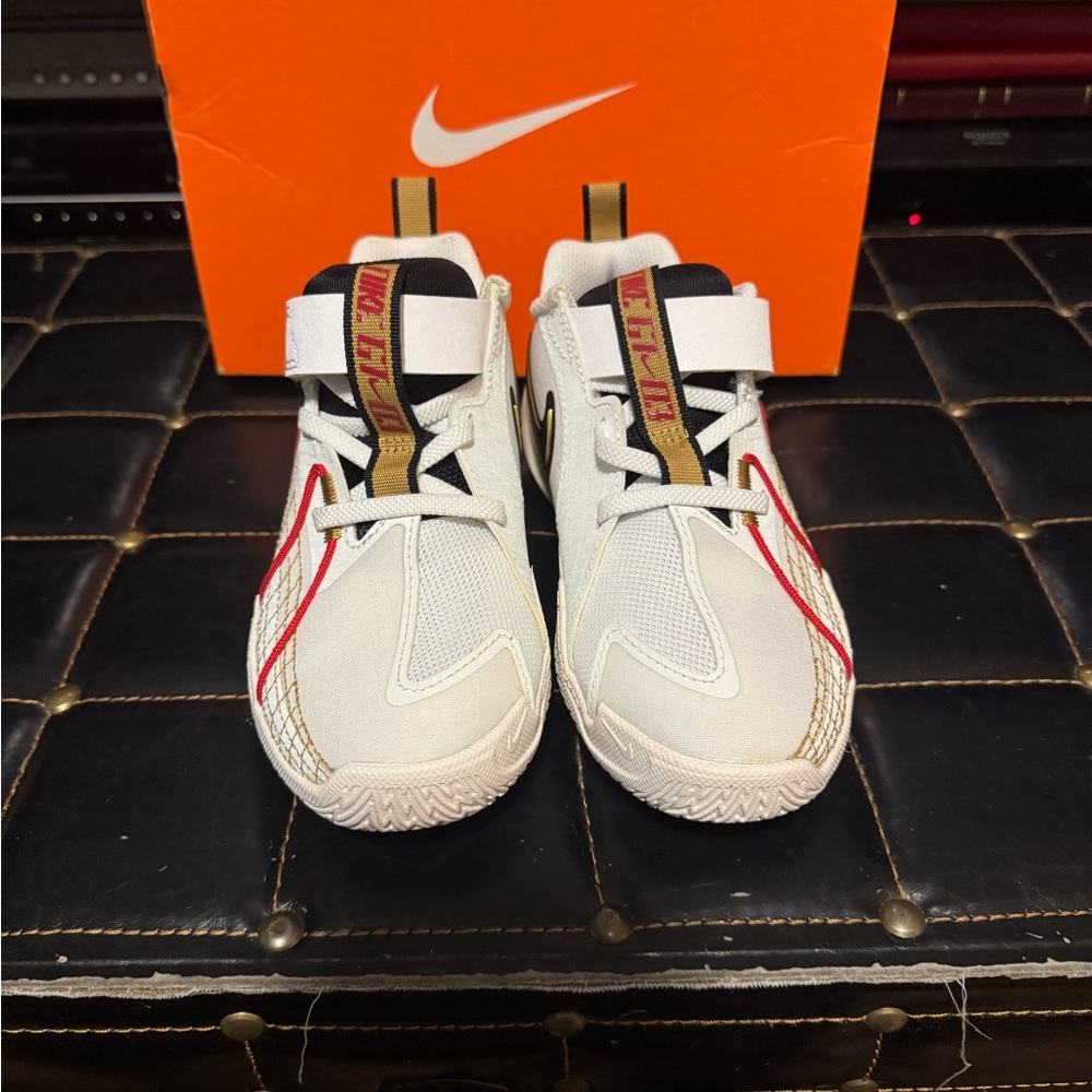 Nike Kids White Sneakers with Red and Gold Accents